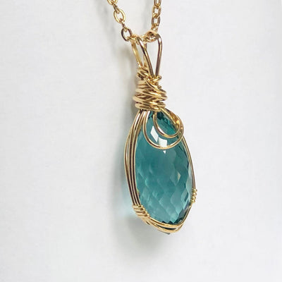 Fayes jewelry Designs Blue zircon pendant Blue zircon gold faceted briolette gemstone pendant