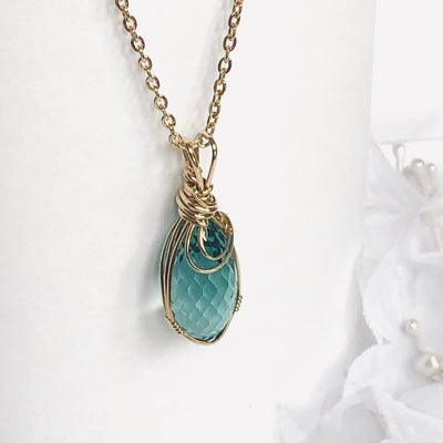 Fayes jewelry Designs Blue zircon pendant Blue zircon gold faceted briolette gemstone pendant