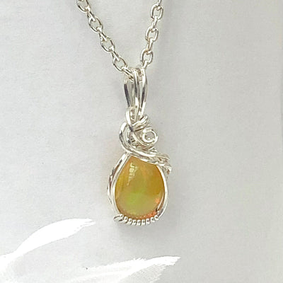 Fayes jewelry Designs Opal pendant Opal gemstone set elegantly in sterling silver